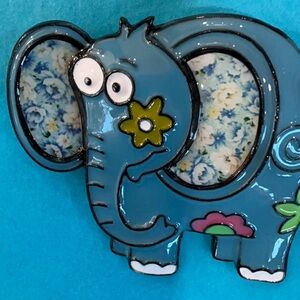 Fabulous fun turquoise elephant with colorful flowers on it  so fun!